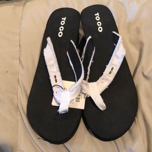 Black heeled flip flops with white top!